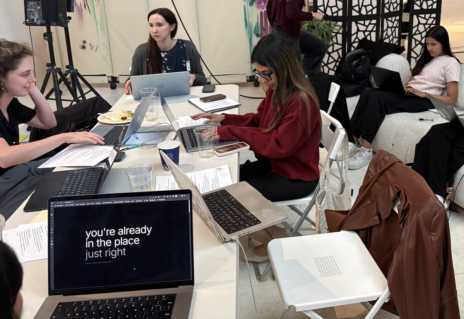 Workshop participants building websites on laptops
